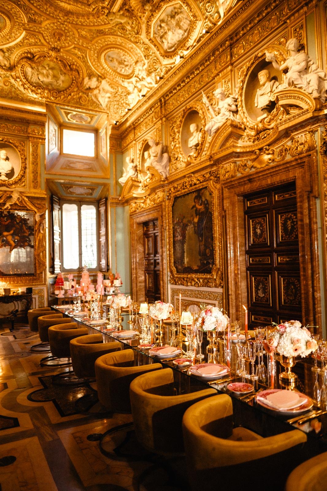 Gilded ballroom set for dinner