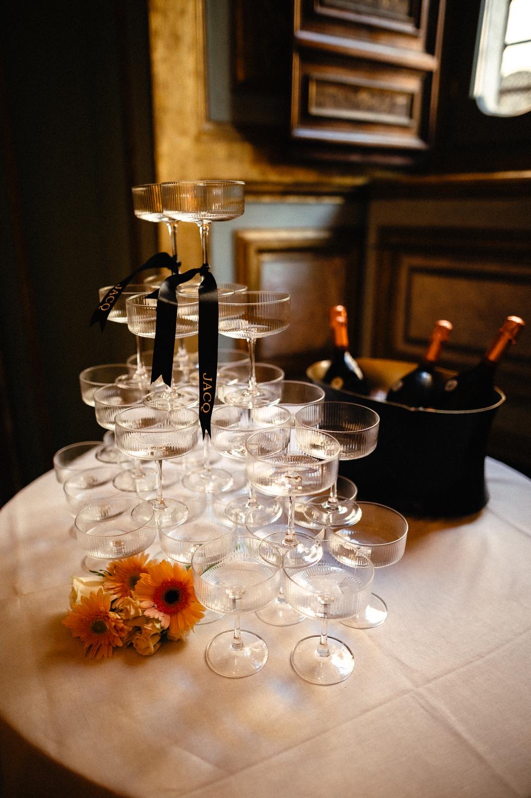 Candlelit glassware on a linen-draped table