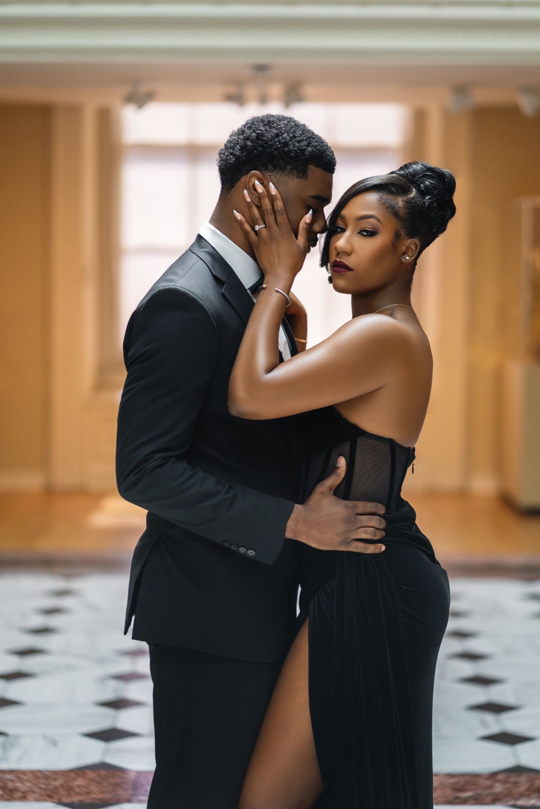 Couple in black tie sharing a quiet moment