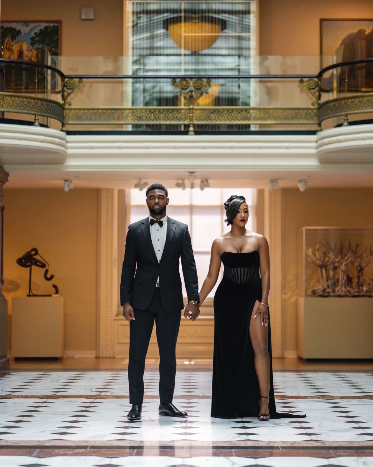 A couple in a grand atrium