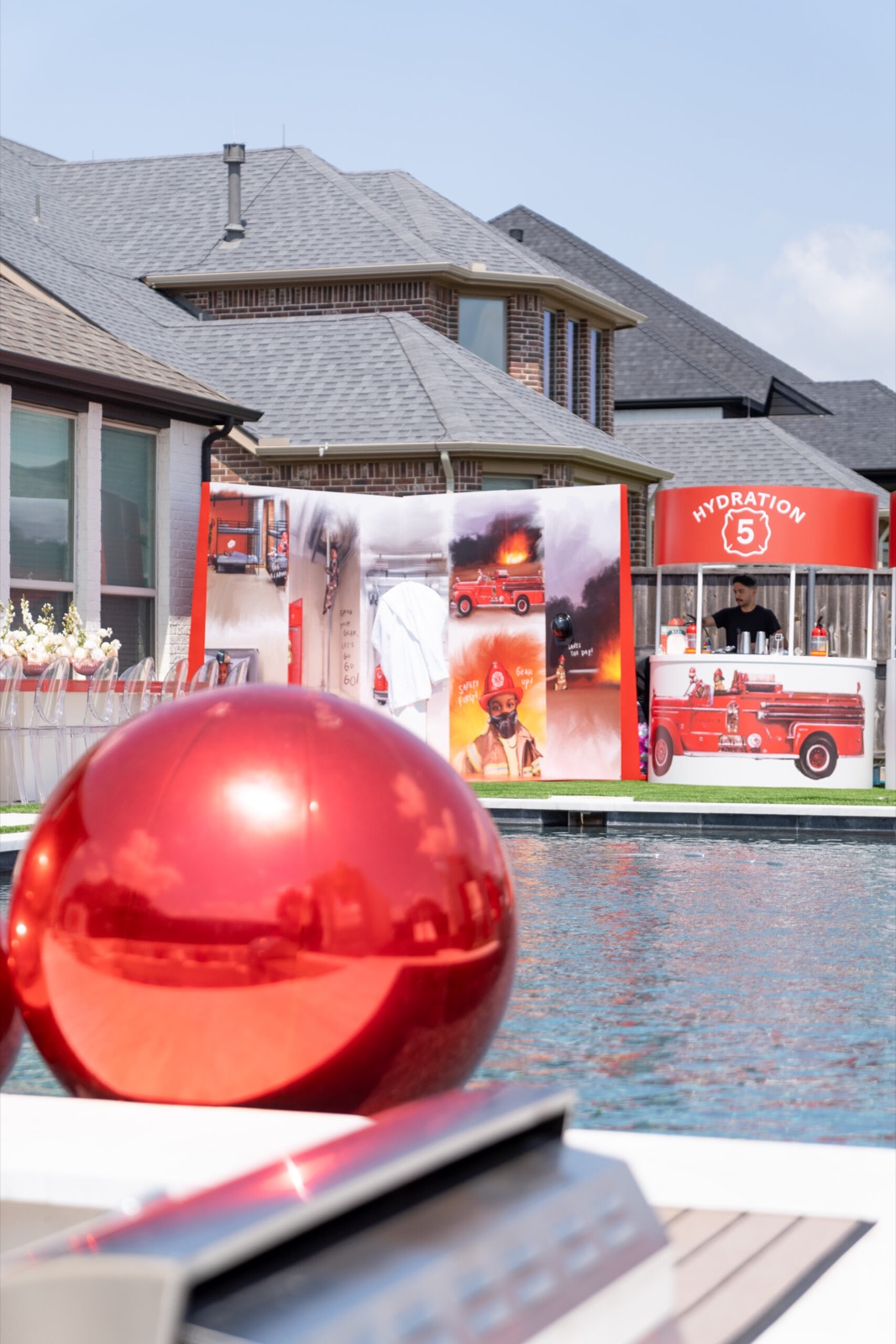 Mirrored red spheres floating in a pool