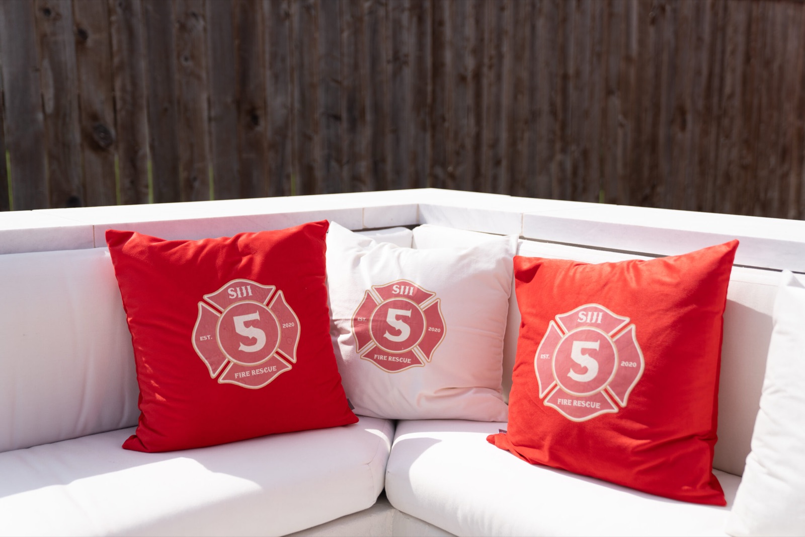 Monogrammed pillows on a white sofa