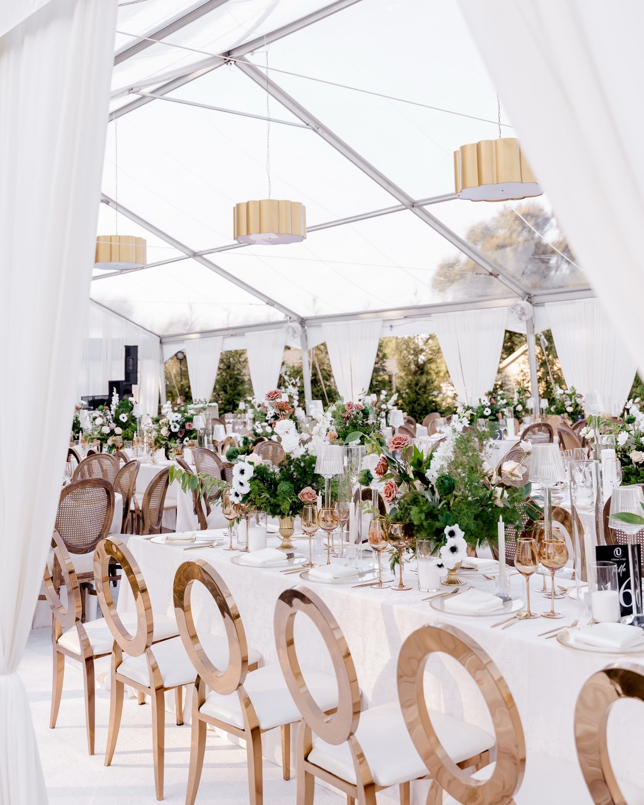 Garden tent reception with lush tablescapes
