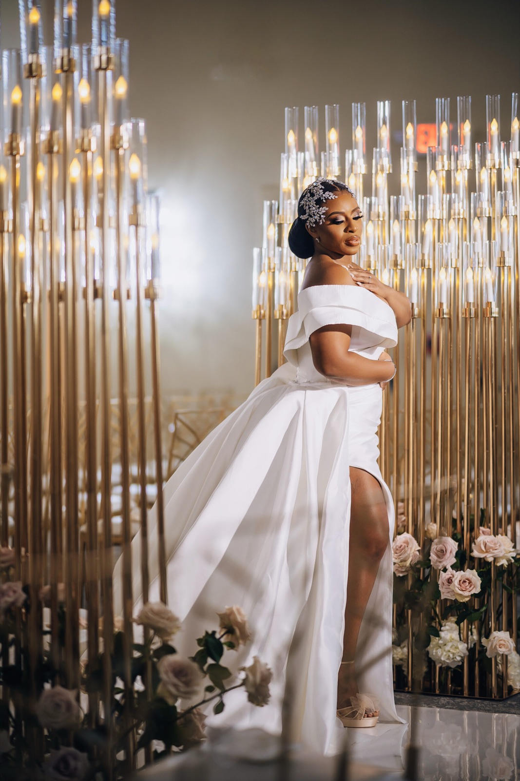 Bridal portrait before a candle wall